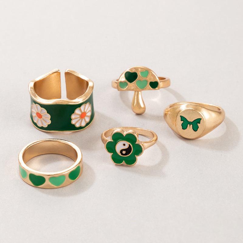 golden and green ring set