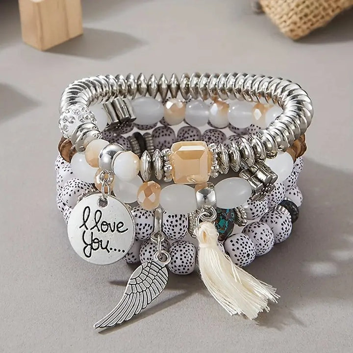 Vembley Trendy Bohemian Bracelet Stack with silver beads, tassel charm, and love pendant for women and girls