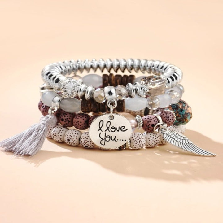 Vembley Trendy Bohemian Bracelet Stack with silver beads, tassel charm, and love pendant for women and girls