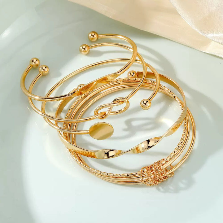 Vembley Trendy 5-Piece Golden Cuff Bracelet Set with Minimalist Knot, Disc and Geometric Designs