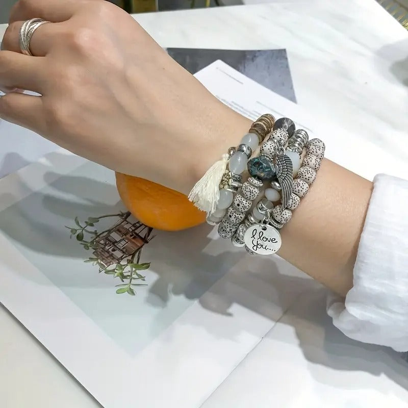 Vembley Trendy Bohemian Bracelet Stack with silver beads, tassel charm, and love pendant for women and girls