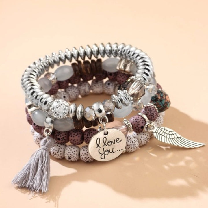 Vembley Trendy Bohemian Bracelet Stack with silver beads, tassel charm, and love pendant for women and girls
