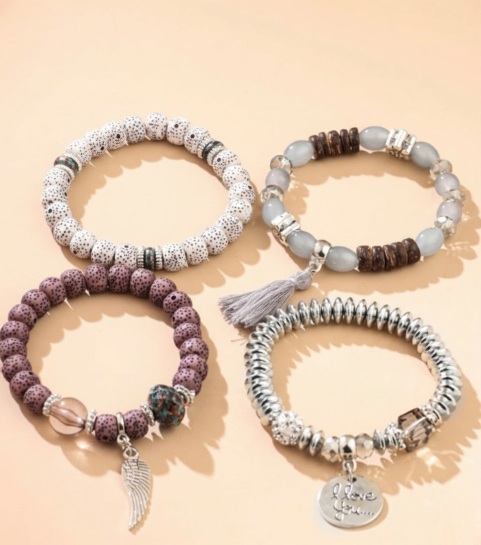 Vembley Trendy Bohemian Bracelet Stack with silver beads, tassel charm, and love pendant for women and girls