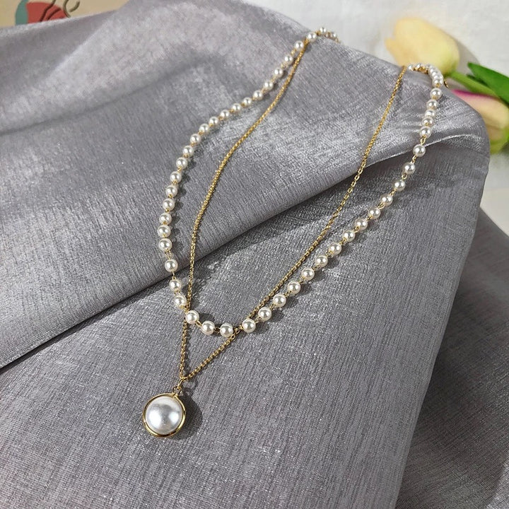 Pack Of 2 Layered Pearl Heart And Lock Pendant