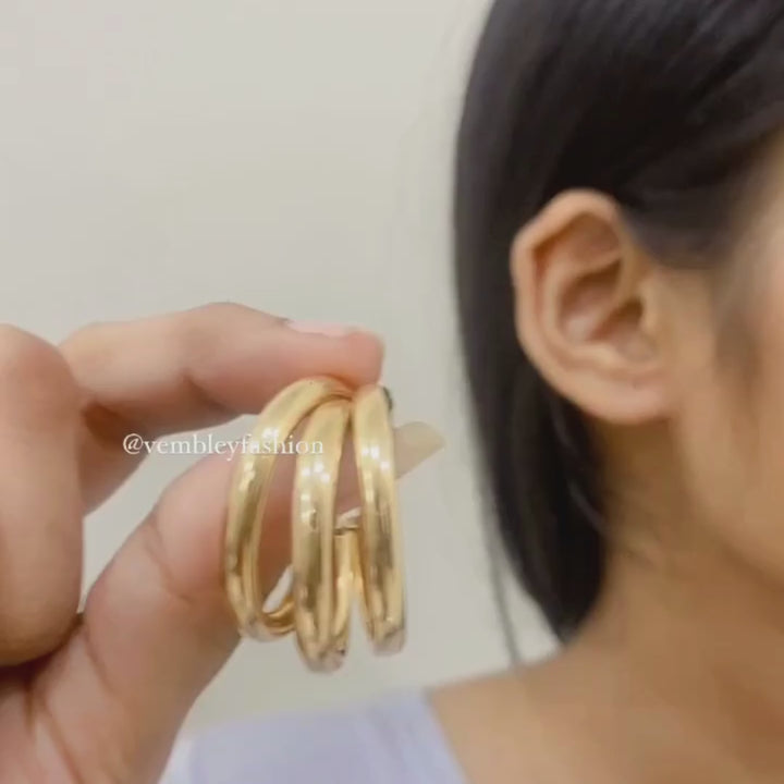 video of golden hoop earrings
